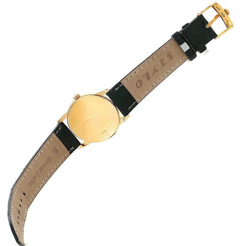 The image shows the back and strap of a Rolex Cellini 5116 Men's Yellow Gold Silver Dial 5116 Men's Yellow Gold Silver Dial watch, displayed horizontally with an open black leather band.