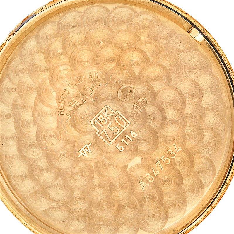 This image shows the inner back cover of a Rolex Cellini 5116 Men's Yellow Gold Silver Dial 5116 Men's Yellow Gold Silver Dial watch with visible engravings and gold hallmarks.