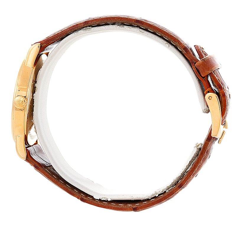 This image shows a side view of the Rolex Cellini 5115 Men's Yellow Gold Grey Dial 5115 Men's Yellow Gold Grey Dial watch, highlighting its brown leather strap and gold case.