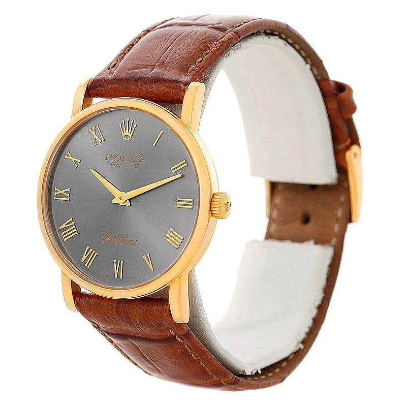 The image shows a Rolex Cellini 5115 Men's Yellow Gold Grey Dial 5115 Men's Yellow Gold Grey Dial watch at a three-quarter angle, highlighting its grey dial, gold case, and brown leather strap.