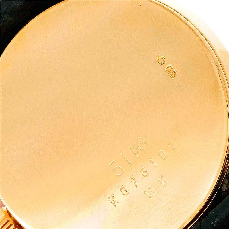 This is an image of the back case of a Rolex Cellini 5116 Men's Yellow Gold Mother of Pearl Dial 5116 Men's Yellow Gold Mother of Pearl Dial watch, showing its engraved serial number and hallmarks.