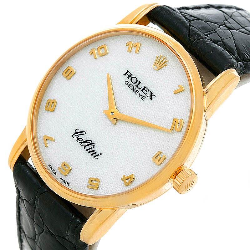The Rolex Cellini 5116 Men's Yellow Gold Mother of Pearl Dial 5116 Men's Yellow Gold Mother of Pearl Dial watch is shown at an oblique angle, highlighting its face, crown, case, and black leather strap.
