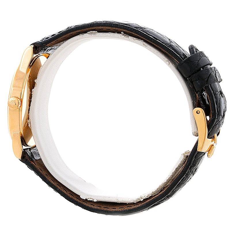 The image shows a side view of a Rolex Cellini 5116 Men's Yellow Gold Mother of Pearl Dial 5116 Men's Yellow Gold Mother of Pearl Dial watch, highlighting its black leather strap and gold case.