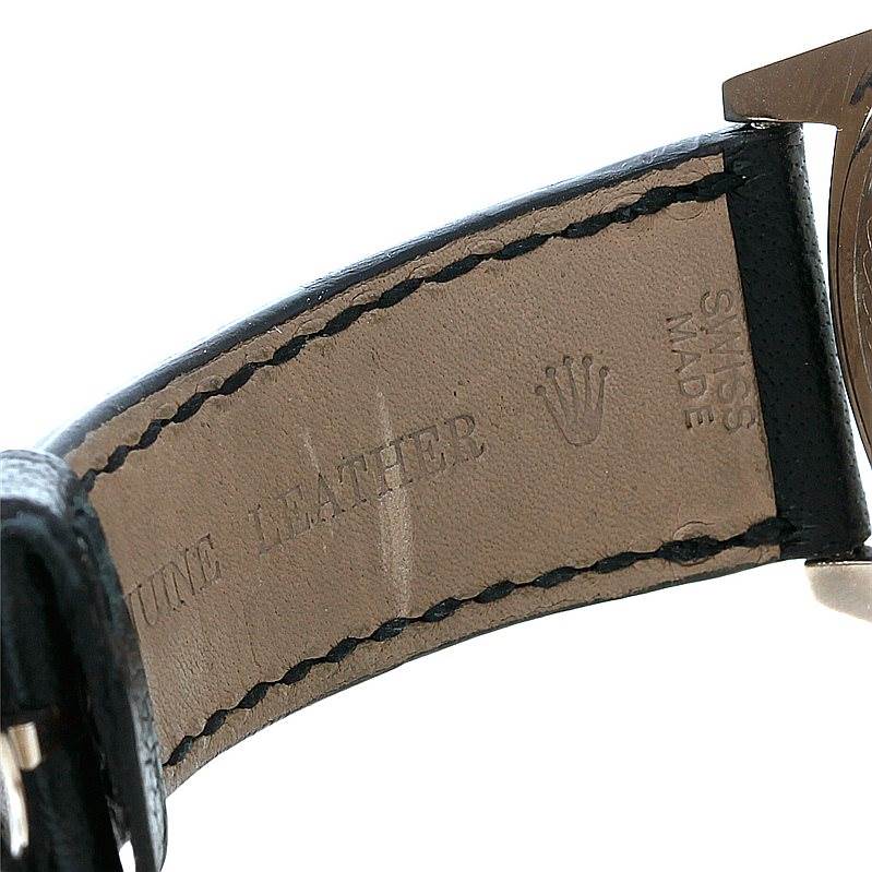 The image shows a close-up of the leather strap and part of the case of a Rolex Cellini 4243 Men's White Gold Black Dial 4243 Men's White Gold Black Dial watch.