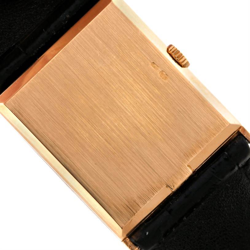 The image shows the back case and crown of a Rolex Cellini 4127 Men
s Yellow Gold Champagne Dial 4127 Men
s Yellow Gold Champagne Dial watch at an angle.