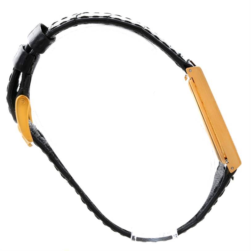 This image shows a side view of a Rolex Cellini 4127 Men
s Yellow Gold Champagne Dial 4127 Men
s Yellow Gold Champagne Dial model watch, highlighting its black leather strap and gold clasp.