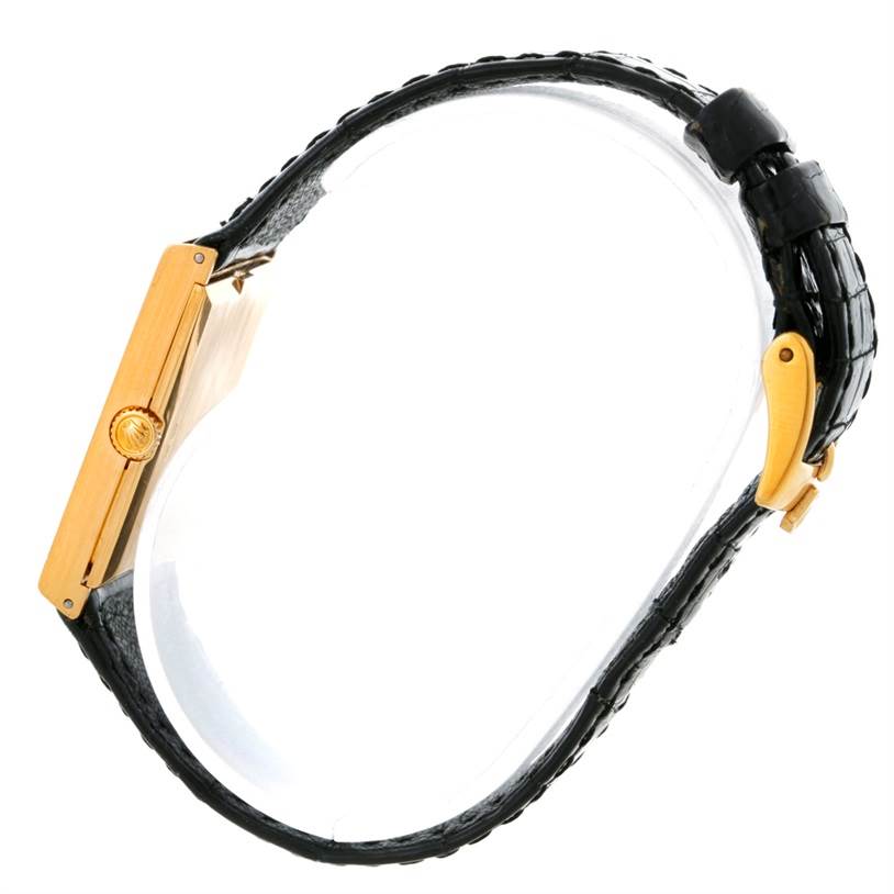 This side view shows the gold case and black leather strap of the Rolex Cellini 4127 Men
s Yellow Gold Champagne Dial 4127 Men
s Yellow Gold Champagne Dial watch.