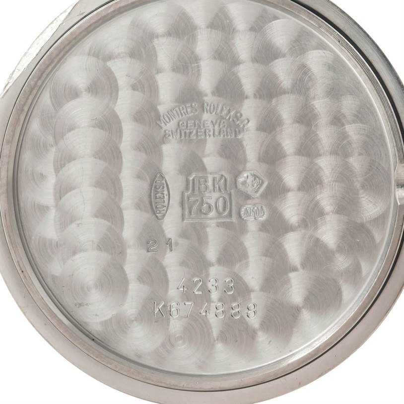 This image shows the inside case back of a Rolex Cellini 4233 Men's White Gold Black Dial 4233 Men's White Gold Black Dial model watch, displaying engravings and hallmarks.