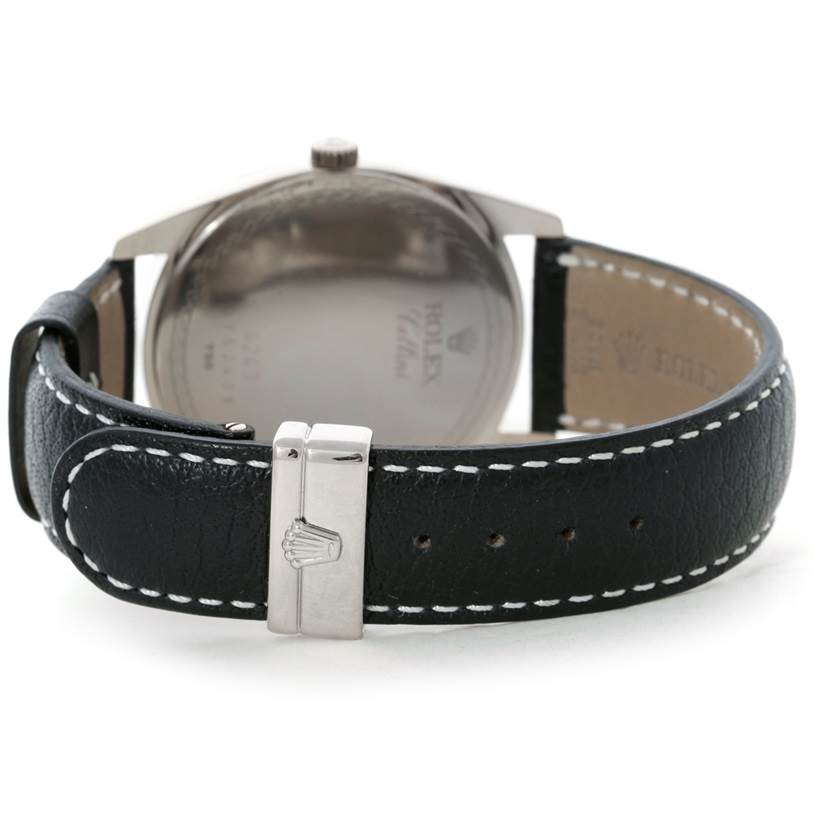 This image shows the back and clasp of the Rolex Cellini 4243 Men's White Gold Black Dial 4243 Men's White Gold Black Dial watch, highlighting the leather strap and buckle.