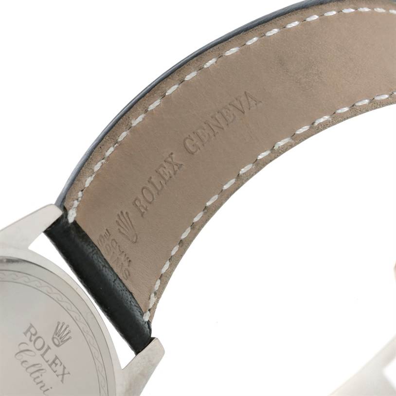 The image shows the back view of a Rolex Cellini 4243 Men's White Gold Black Dial 4243 Men's White Gold Black Dial watch with focus on the leather strap and engraved branding.