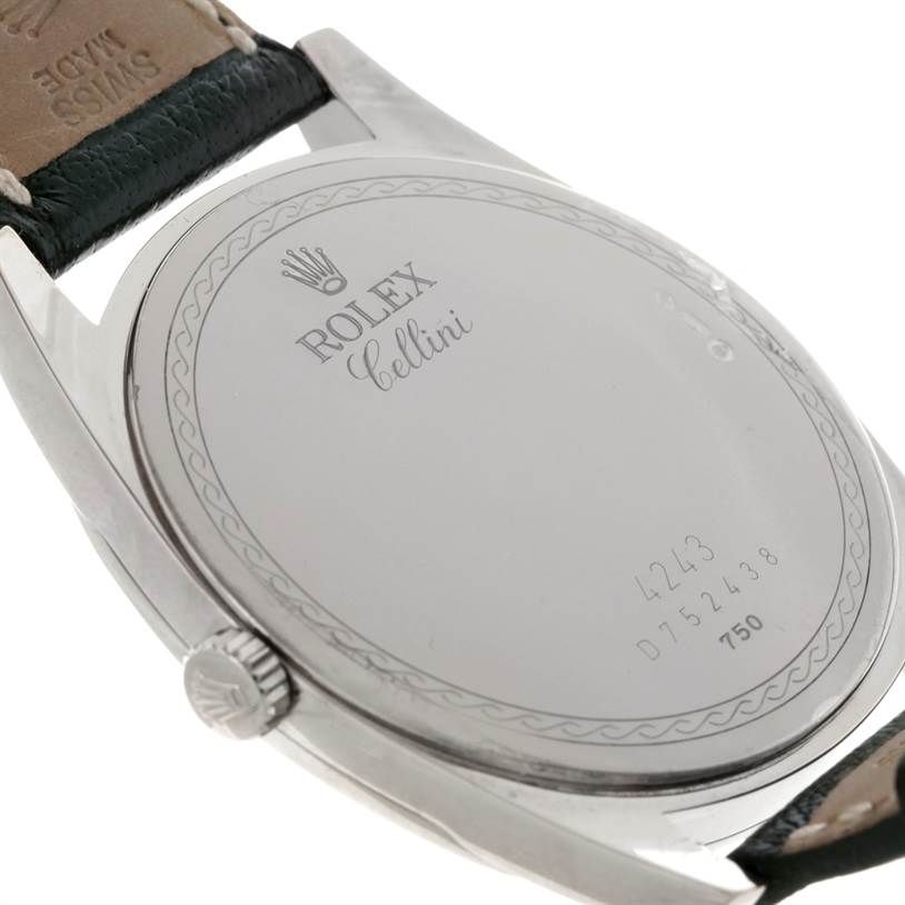 The image shows the back case and part of the strap of a Rolex Cellini 4243 Men's White Gold Black Dial 4243 Men's White Gold Black Dial watch at an angled view.