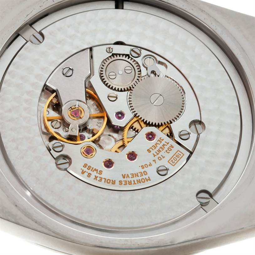 This image shows a close-up view of the intricate mechanical movement of the Rolex Cellini 4243 Men's White Gold Black Dial 4243 Men's White Gold Black Dial watch from the back.