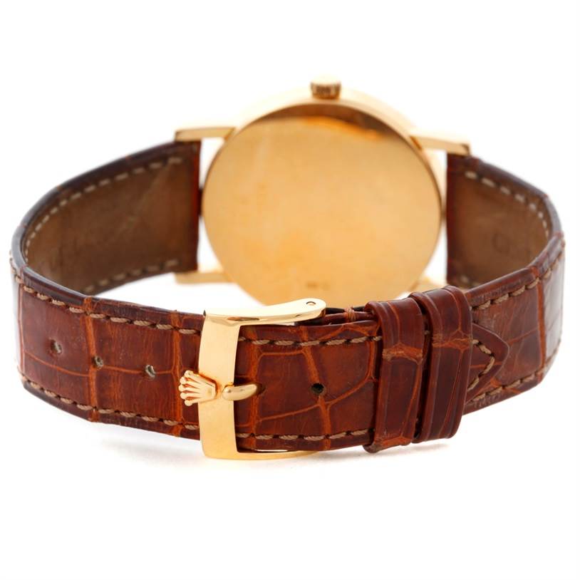 The image shows the backside and clasp of a Rolex Cellini 5115 Men's Yellow Gold Mother of Pearl Dial 5115 Men's Yellow Gold Mother of Pearl Dial watch with a brown leather strap.