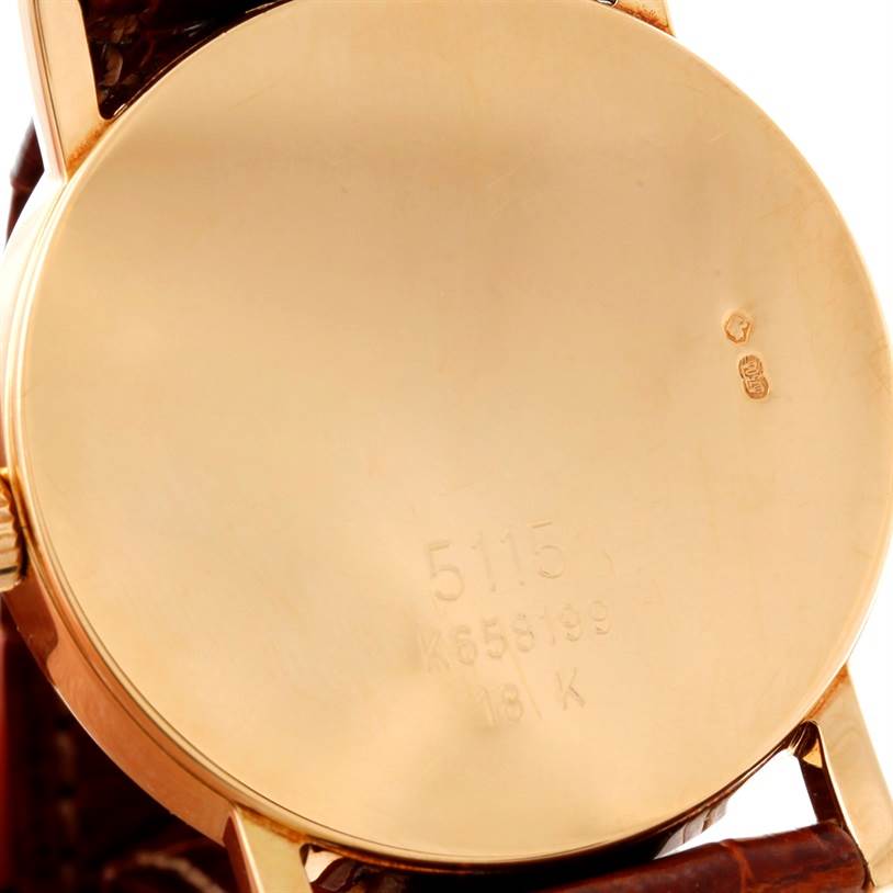 The image shows the back of a Rolex Cellini 5115 Men's Yellow Gold Mother of Pearl Dial 5115 Men's Yellow Gold Mother of Pearl Dial model watch, highlighting the engraved case back and part of the watch strap.