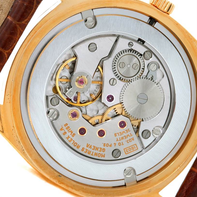 This image shows the back view of the Rolex Cellini 4233 Men's Yellow Gold Black Dial 4233 Men's Yellow Gold Black Dial watch, revealing its intricate internal mechanical movement.