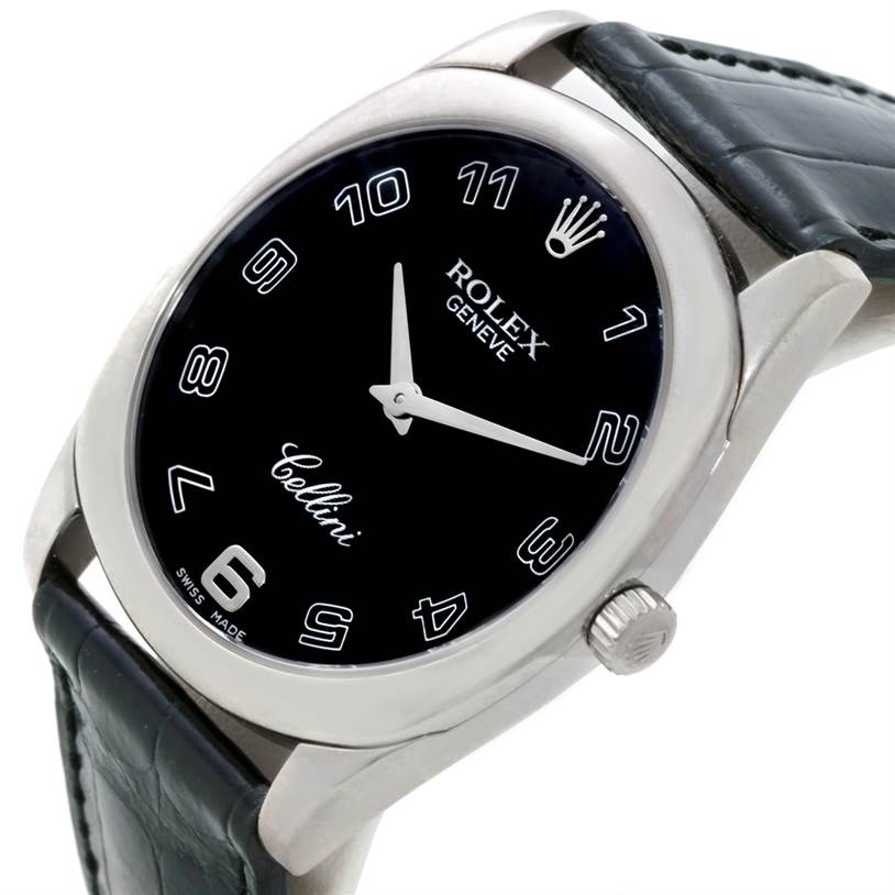 The image shows an angled view of a Rolex Cellini 4233 Men's White Gold Black Dial 4233 Men's White Gold Black Dial watch, displaying its black dial, numerals, and part of the leather strap.