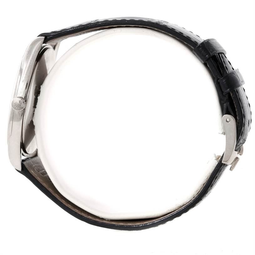 The image shows the Rolex Cellini 4233 Men's White Gold Black Dial 4233 Men's White Gold Black Dial watch from a side view, highlighting the case and part of the leather strap.