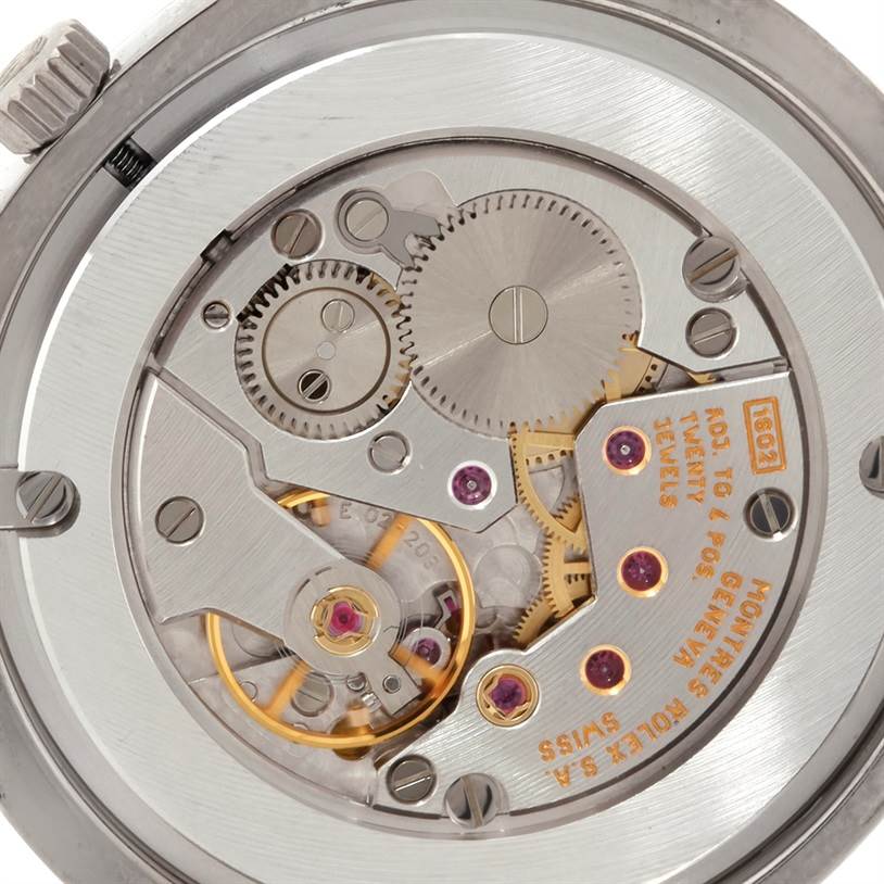 The image shows the intricate internal mechanisms of the Rolex Cellini 4233 Men's White Gold Black Dial 4233 Men's White Gold Black Dial watch, viewed from the back.