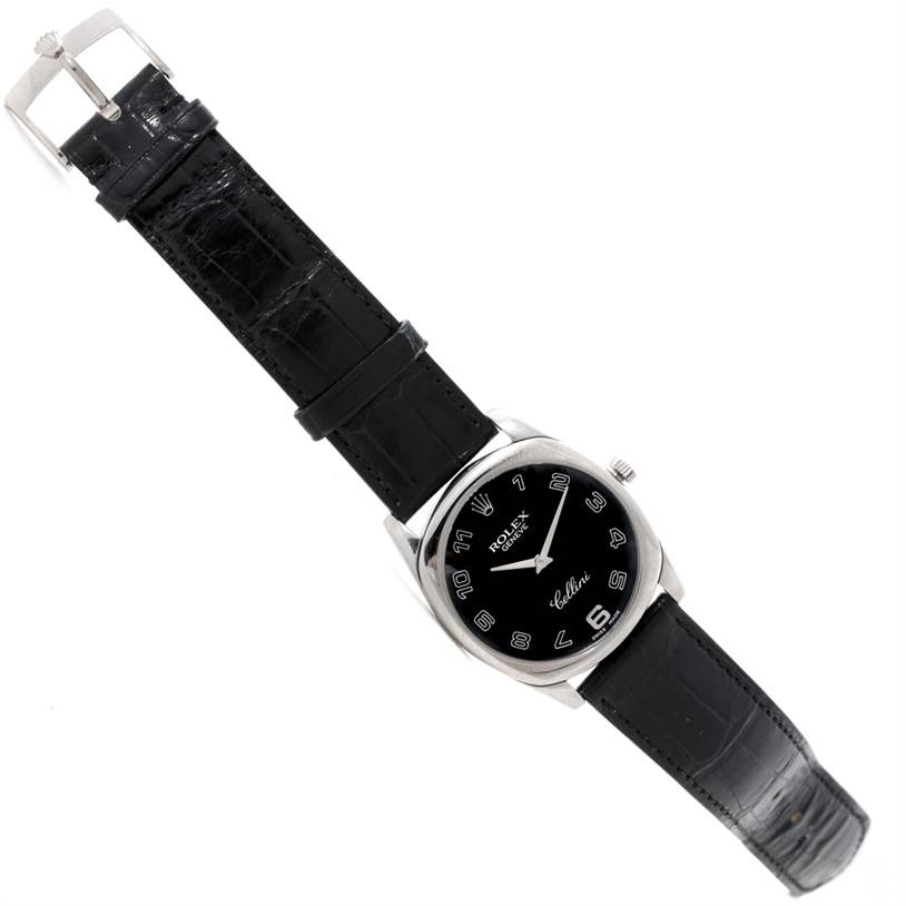 This image shows a top-down view of a Rolex Cellini 4233 Men's White Gold Black Dial 4233 Men's White Gold Black Dial watch, displaying the black dial, silver casing, and leather strap.