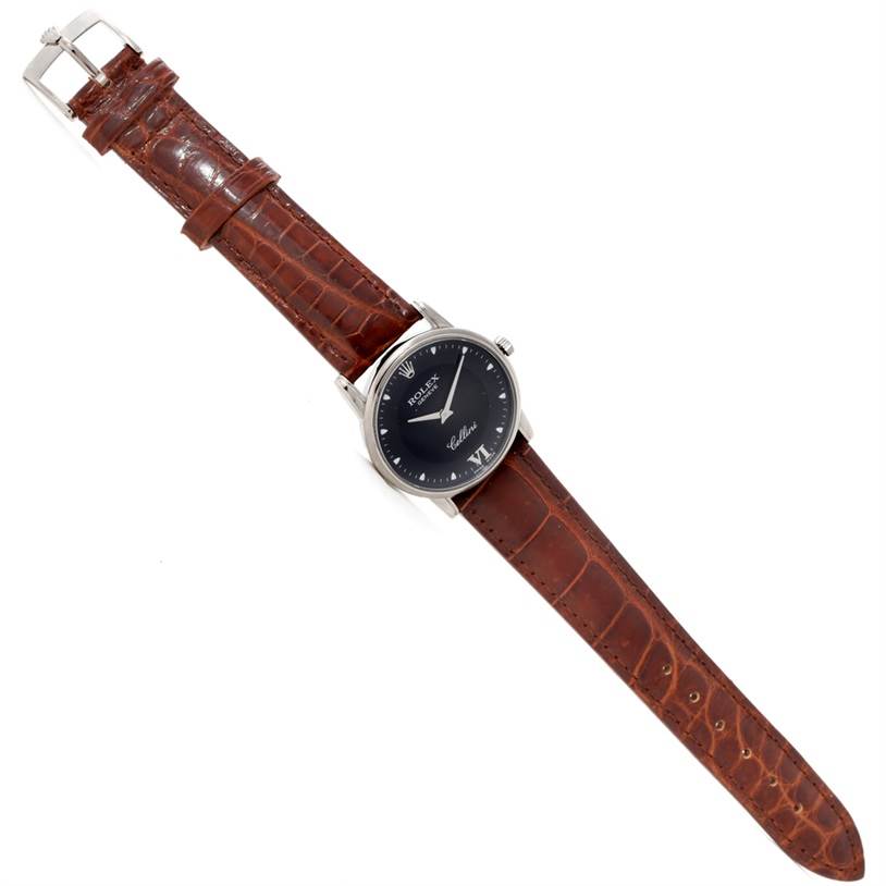This image shows a Rolex Cellini 5116 Men's White Gold Black Dial 5116 Men's White Gold Black Dial watch, displayed flat, featuring its face, case, and brown leather strap.