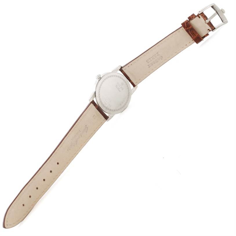 The image shows the back view of a Rolex Cellini 5116 Men's White Gold Black Dial 5116 Men's White Gold Black Dial watch, highlighting its leather strap and buckle.