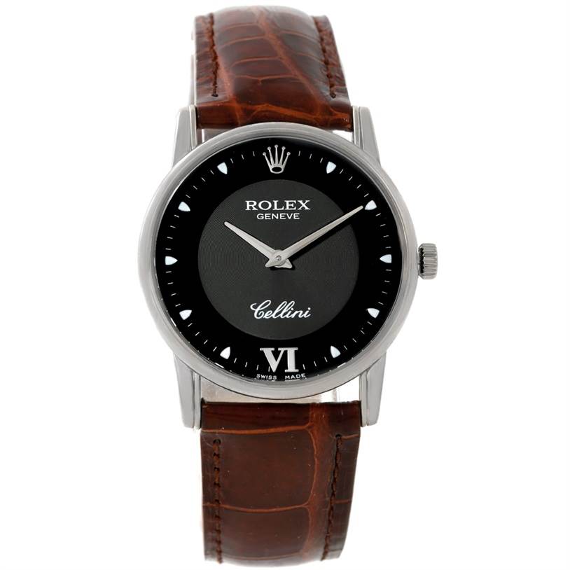 The Rolex Cellini 5116 Men's White Gold Black Dial 5116 Men's White Gold Black Dial watch is shown from a front angle, displaying its face, crown, and leather strap.