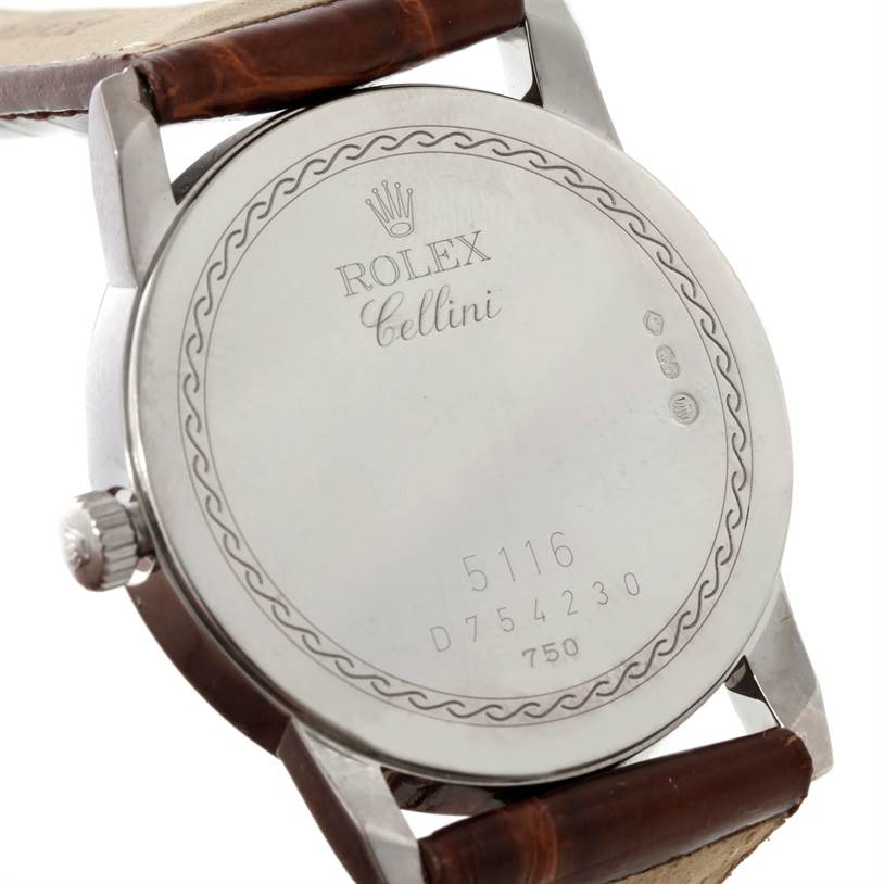 This image shows the back case and part of the strap of a Rolex Cellini 5116 Men's White Gold Black Dial 5116 Men's White Gold Black Dial model watch.