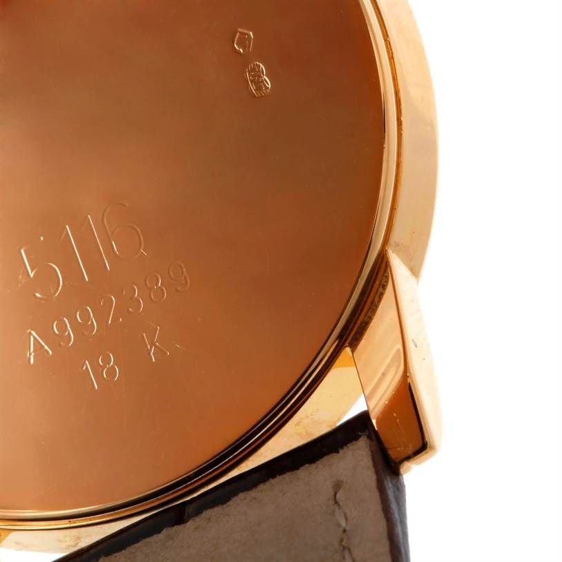 This image shows the back of the Rolex Cellini 5116 Men's Yellow Gold Grey Dial 5116 Men's Yellow Gold Grey Dial watch, highlighting its 18K gold case and engraved model numbers.
