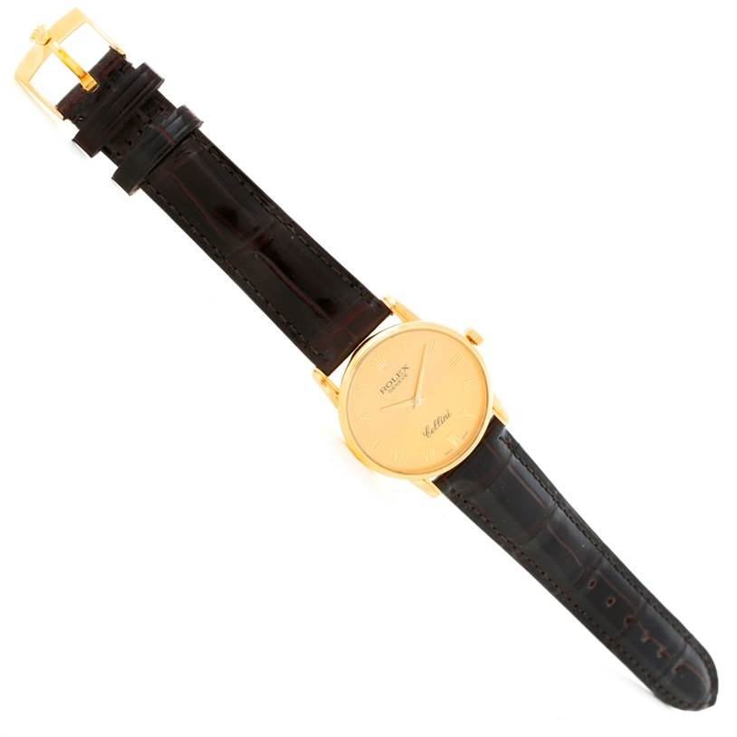 The image shows a top view of a Rolex Cellini 5116 Men
s Yellow Gold Champagne Dial 5116 Men
s Yellow Gold Champagne Dial model watch, displaying the face, strap, and buckle.