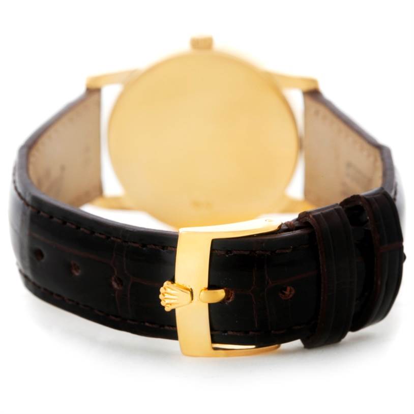 The image shows the buckle and back casing of a Rolex Cellini 5116 Men
s Yellow Gold Champagne Dial 5116 Men
s Yellow Gold Champagne Dial watch, viewed from the strap
s end.