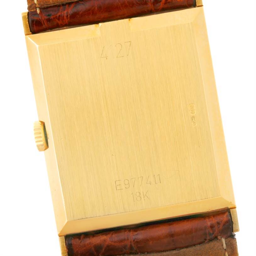 This image shows the back view of a Rolex Cellini 4127 Men's Yellow Gold Brown Dial 4127 Men's Yellow Gold Brown Dial watch, highlighting its gold case and leather strap.