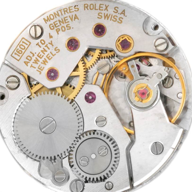 The image shows the intricate internal mechanical movement of a Rolex Cellini 4127 Men's Yellow Gold Brown Dial 4127 Men's Yellow Gold Brown Dial watch from a top-down angle.