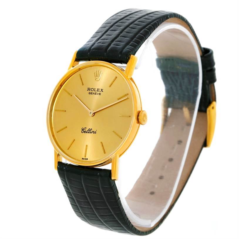 This Rolex Cellini 3833 Men
s Yellow Gold Champagne Dial 3833 Men
s Yellow Gold Champagne Dial watch is shown at a slight side angle, displaying the gold face, crown, and black leather strap.