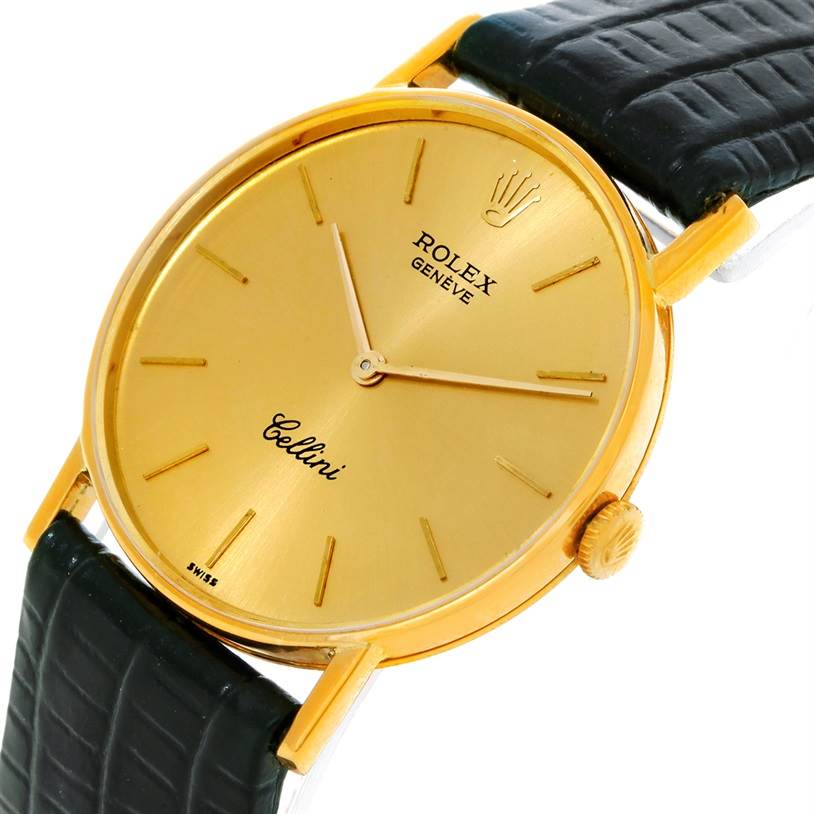 This image shows a Rolex Cellini 3833 Men
s Yellow Gold Champagne Dial 3833 Men
s Yellow Gold Champagne Dial watch from an angled view focusing on its golden dial and black leather strap.