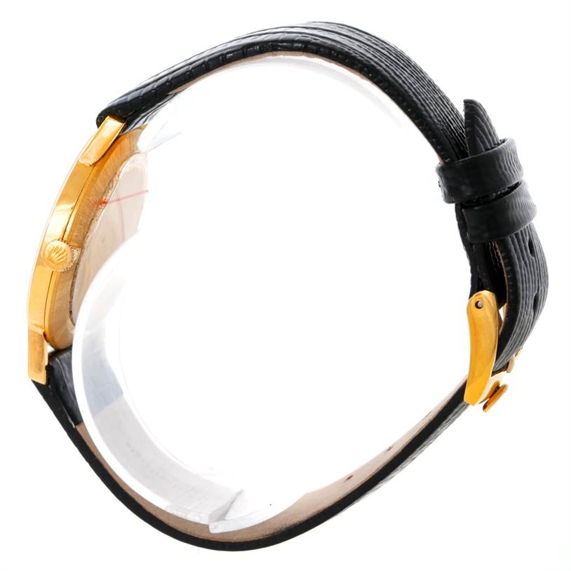 The image shows a side view of a Rolex Cellini 3833 Men
s Yellow Gold Champagne Dial 3833 Men
s Yellow Gold Champagne Dial watch featuring the case, crown, and band.