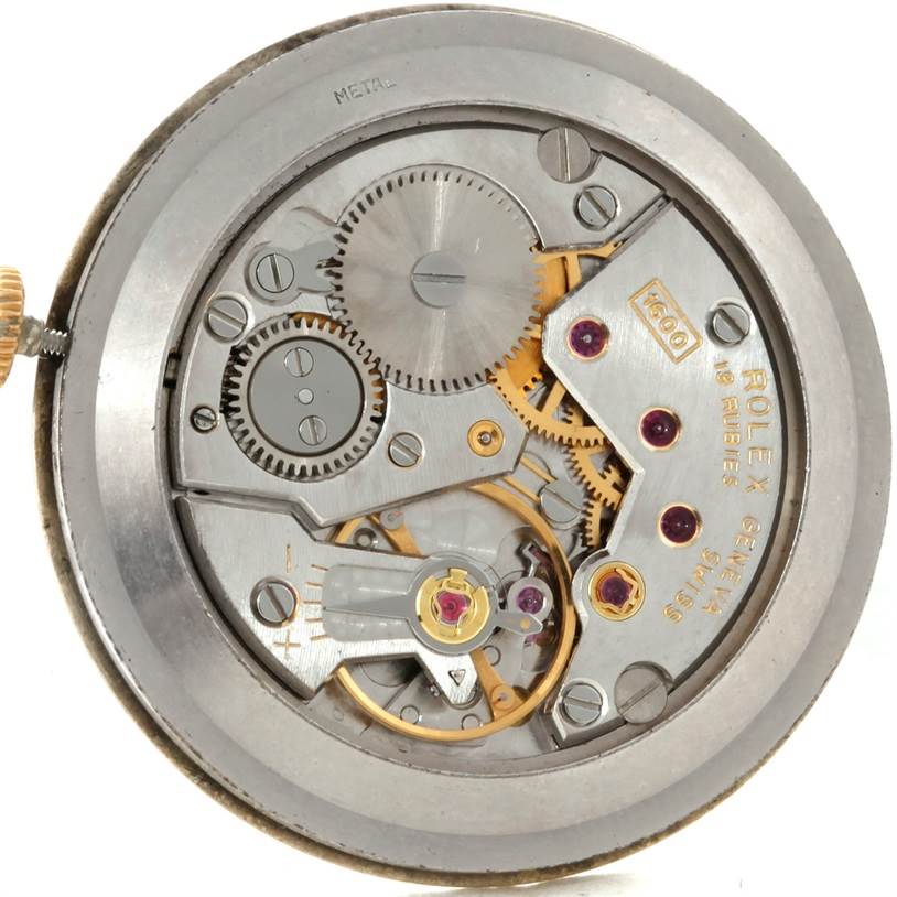 The image shows the inner mechanical components of a Rolex Cellini 3833 Men
s Yellow Gold Champagne Dial 3833 Men
s Yellow Gold Champagne Dial watch from a top-down angle.