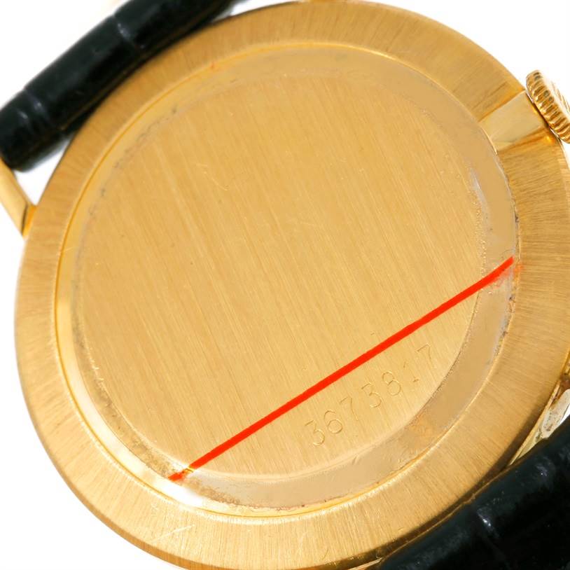 The image shows the back case of a Rolex Cellini 3833 Men
s Yellow Gold Champagne Dial 3833 Men
s Yellow Gold Champagne Dial watch, captured from the rear angle.