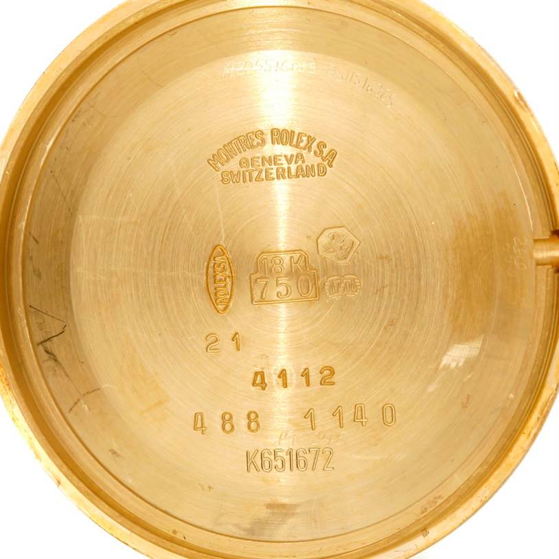 This image shows the inside case back of a Rolex Cellini 4112 Men
s Yellow Gold Champagne Dial 4112 Men
s Yellow Gold Champagne Dial model, featuring inscriptions and markings including the brand and material details.