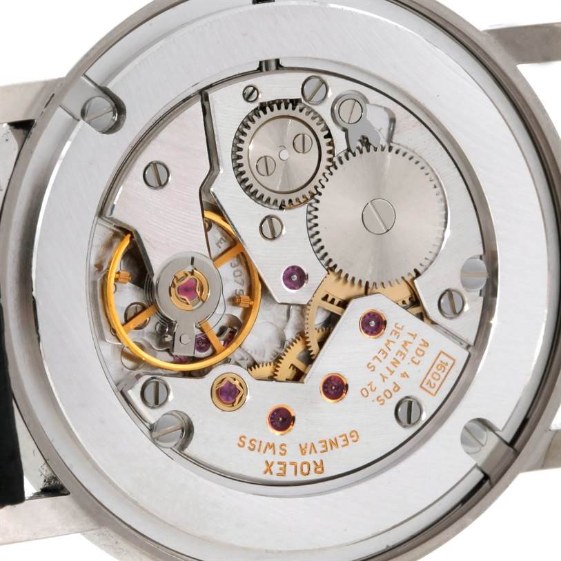 The image shows the back view of a Rolex Cellini 5116 Men's White Gold Silver Dial 5116 Men's White Gold Silver Dial watch, revealing its intricate mechanical movement.