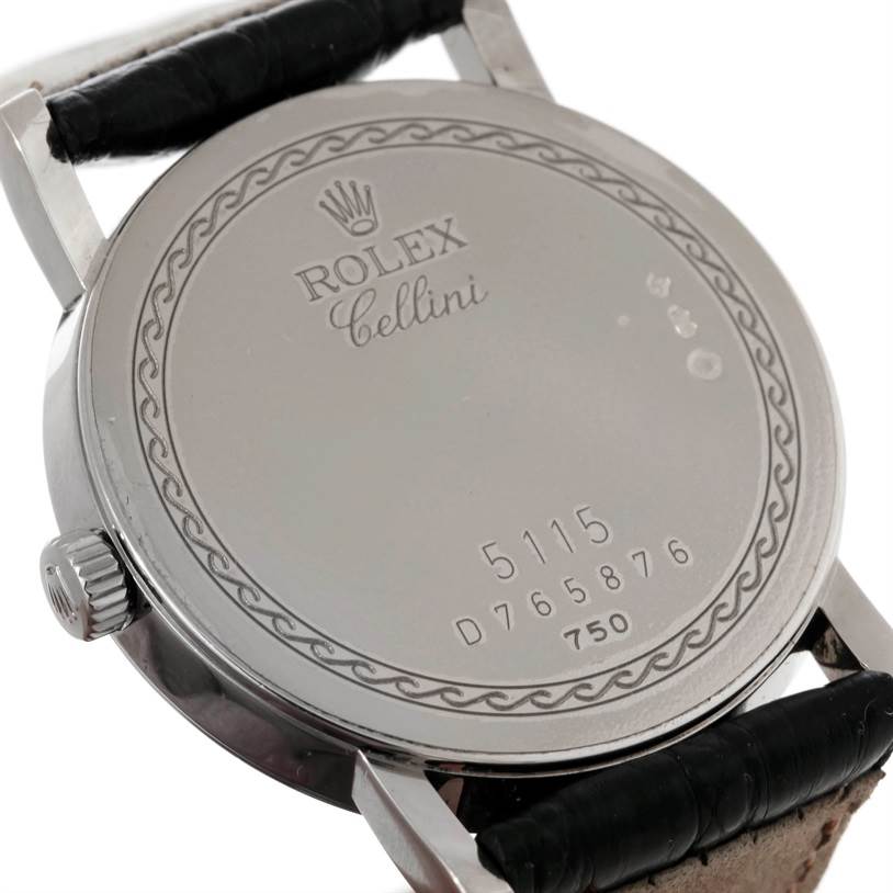 The image shows the back case of a Rolex Cellini 5116 Men's White Gold Silver Dial 5116 Men's White Gold Silver Dial model watch at an oblique angle, displaying its engravings.
