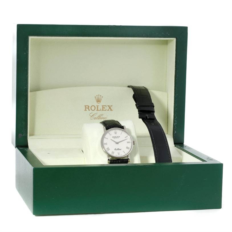 The Rolex Cellini 5116 Men's White Gold Silver Dial 5116 Men's White Gold Silver Dial watch is shown in an open green box, displaying its face and black strap from a front angle.