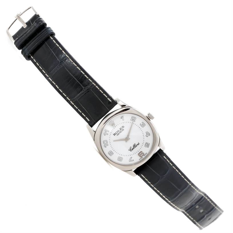 The Rolex Cellini 4233 Men's White Gold White Dial 4233 Men's White Gold White Dial watch is shown lying flat, displaying its face, black leather strap, and buckle.