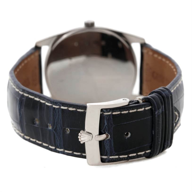 The image shows the back view of the Rolex Cellini 4233 Men's White Gold White Dial 4233 Men's White Gold White Dial watch, including its leather strap and clasp.