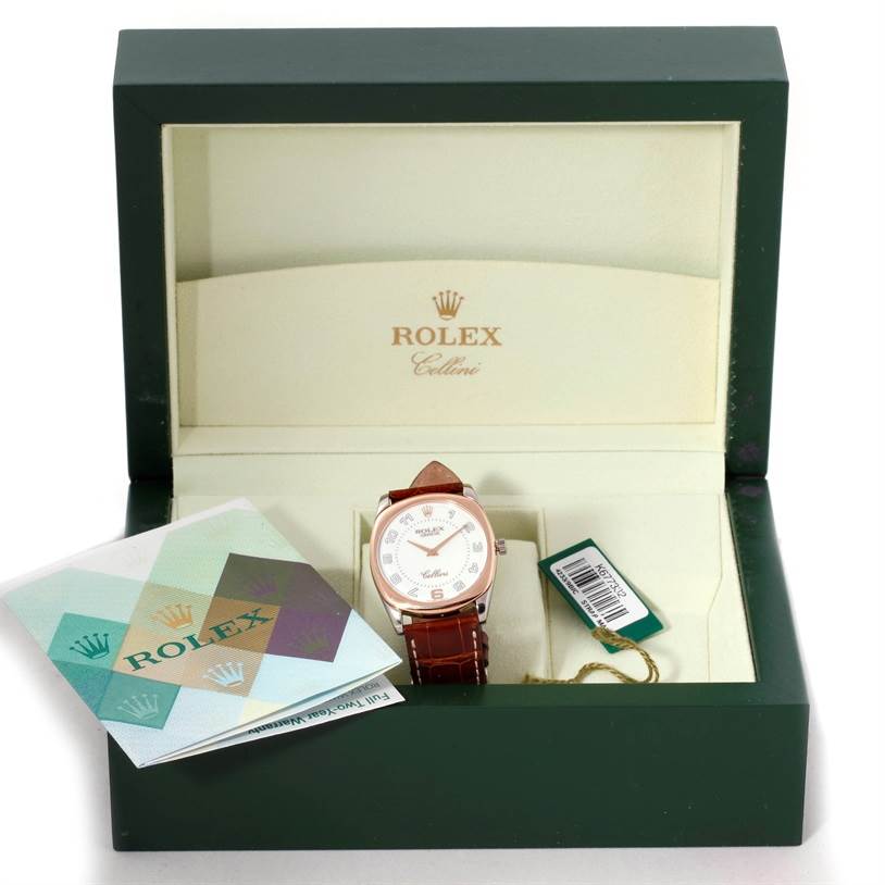 The image shows a Rolex Cellini 4233 Men's White Gold White Dial 4233 Men's White Gold White Dial watch in its open box, along with additional accessories and documentation.
