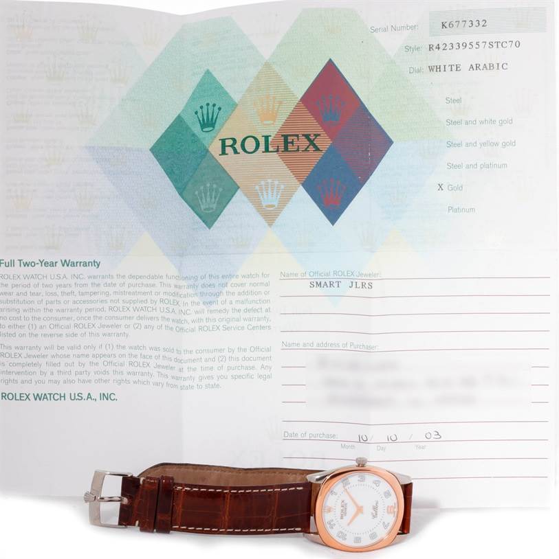 The image shows a Rolex Cellini 4233 Men's White Gold White Dial 4233 Men's White Gold White Dial watch with a brown leather strap and warranty paperwork in the background.
