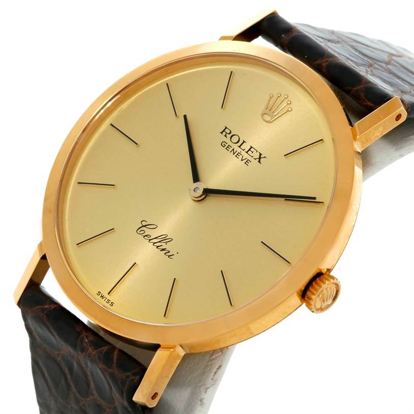 The image shows a close-up view of the Rolex Cellini 4112 Men
s Yellow Gold Champagne Dial 4112 Men
s Yellow Gold Champagne Dial watch, highlighting the dial, case, crown, and part of the leather strap.