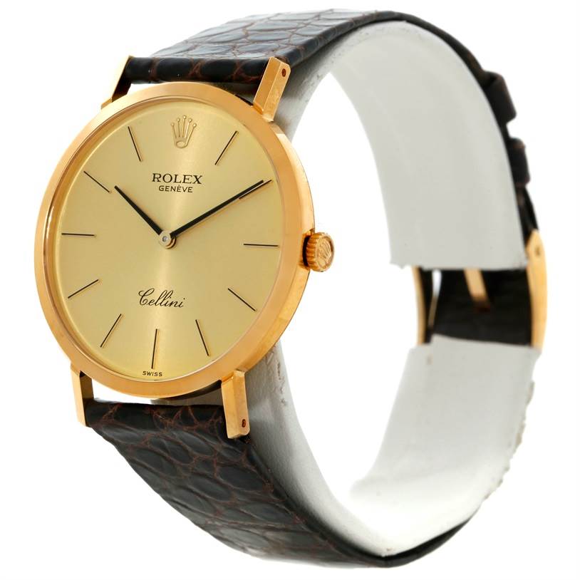 The Rolex Cellini 4112 Men
s Yellow Gold Champagne Dial 4112 Men
s Yellow Gold Champagne Dial watch is shown from a side angle, highlighting the face, crown, and leather strap.