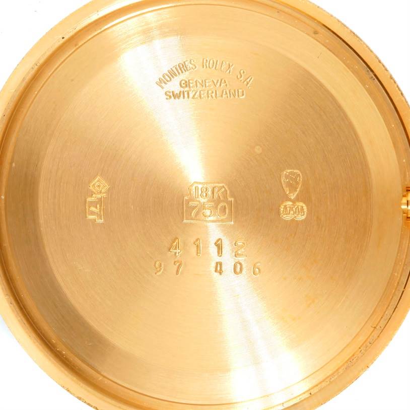 This image shows the interior case back of a Rolex Cellini 4112 Men
s Yellow Gold Champagne Dial 4112 Men
s Yellow Gold Champagne Dial watch, featuring markings such as 18K gold and manufacturer details.