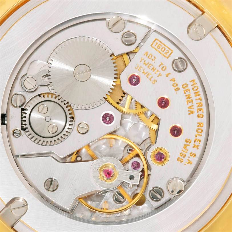 The image shows the intricate internal mechanical movement of a Rolex Cellini 4233 Men's Yellow Gold Black Dial 4233 Men's Yellow Gold Black Dial watch, viewed from the back casing.
