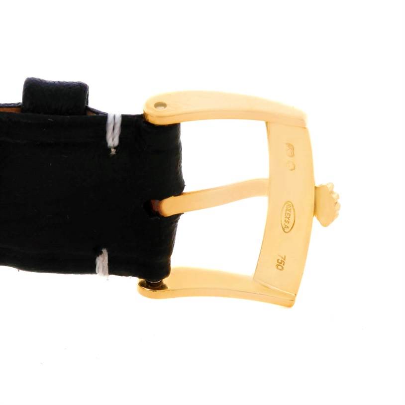 This image shows a close-up of the clasp and part of the leather strap of a Rolex Cellini 4233 Men's Yellow Gold Black Dial 4233 Men's Yellow Gold Black Dial watch.